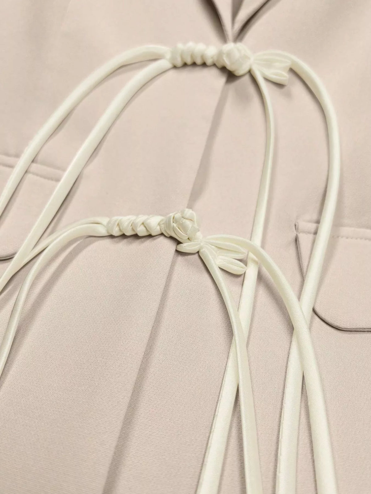 Women's Chinese-Style Knot Lapel Collar Blazer in beige — closure detail view