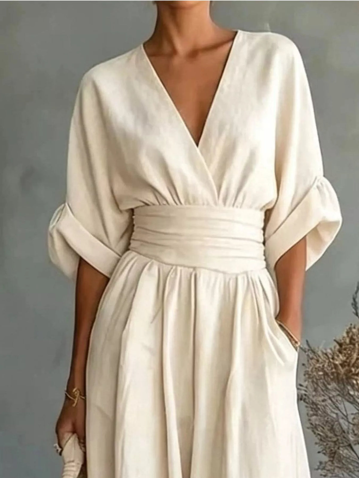 Cream V-neck wide-leg jumpsuit, bodice detail