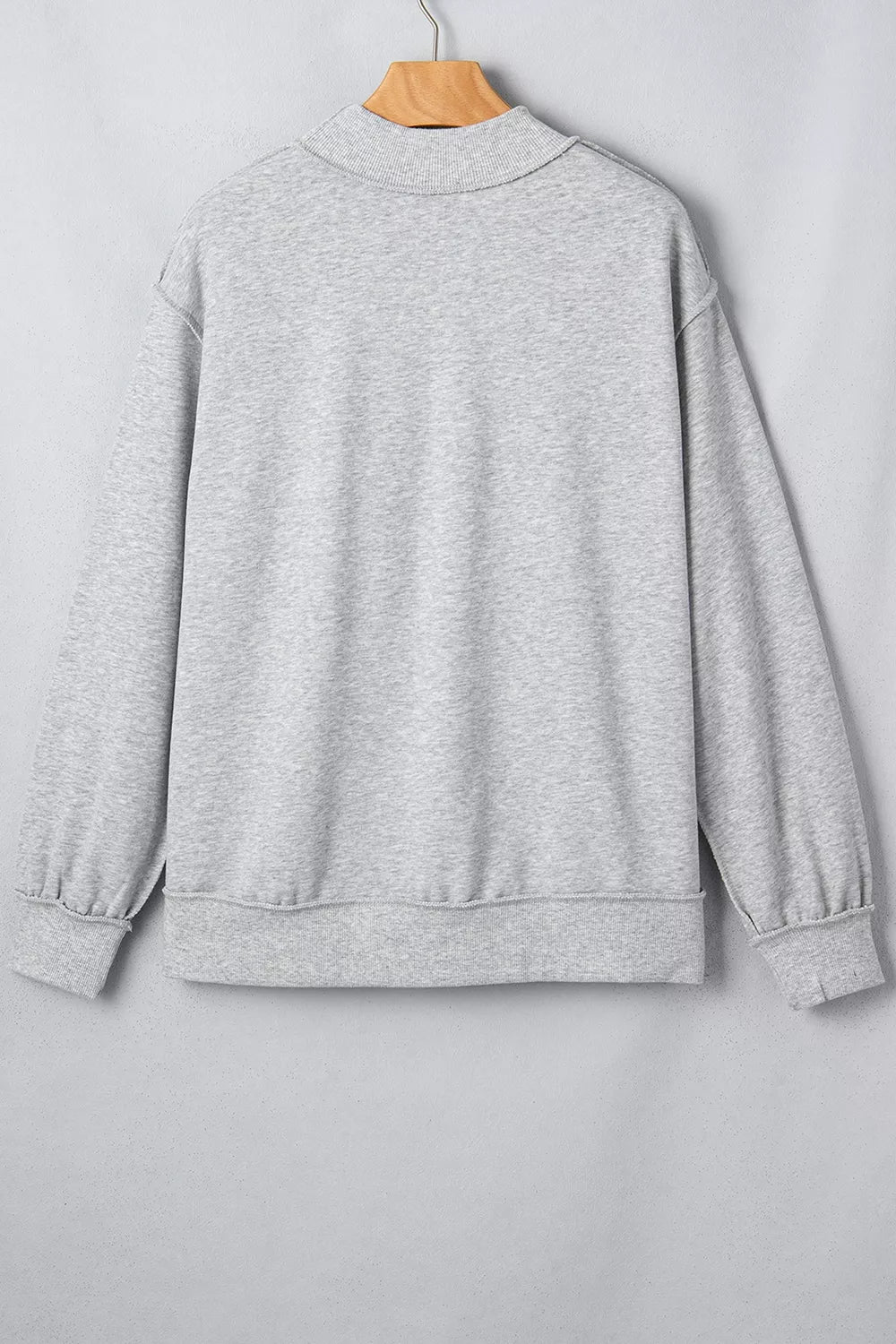 STATE Graphic Exposed Seam Mock Neck Sweatshirt in gray, hanger back view