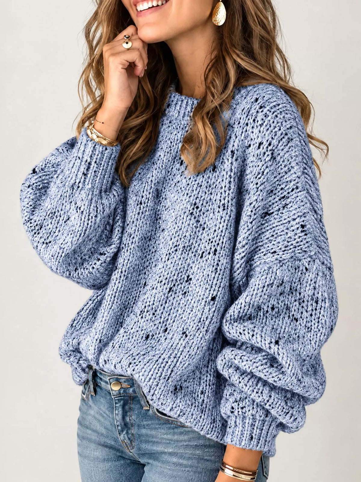 Light blue chunky knit round neck sweater, side view