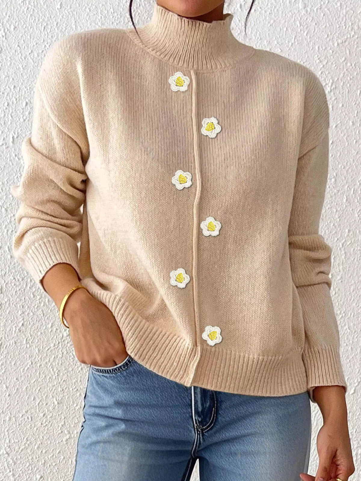 Beige floral applique mock-neck sweater, front view.