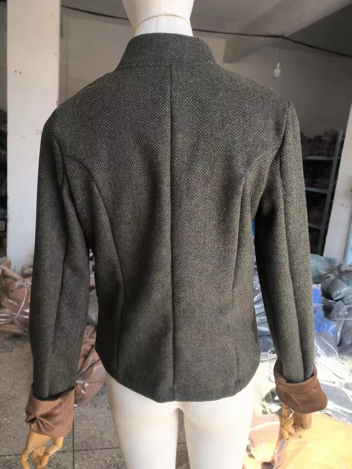 Gray herringbone tweed blazer with velvet cuffs, back view