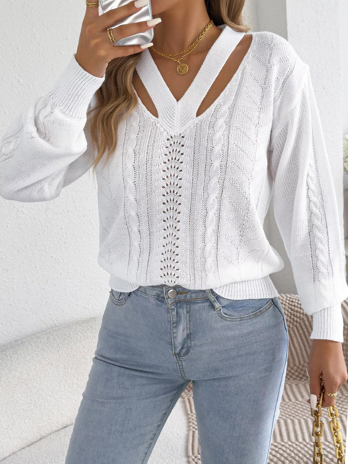 White cut-out cable knit sweater