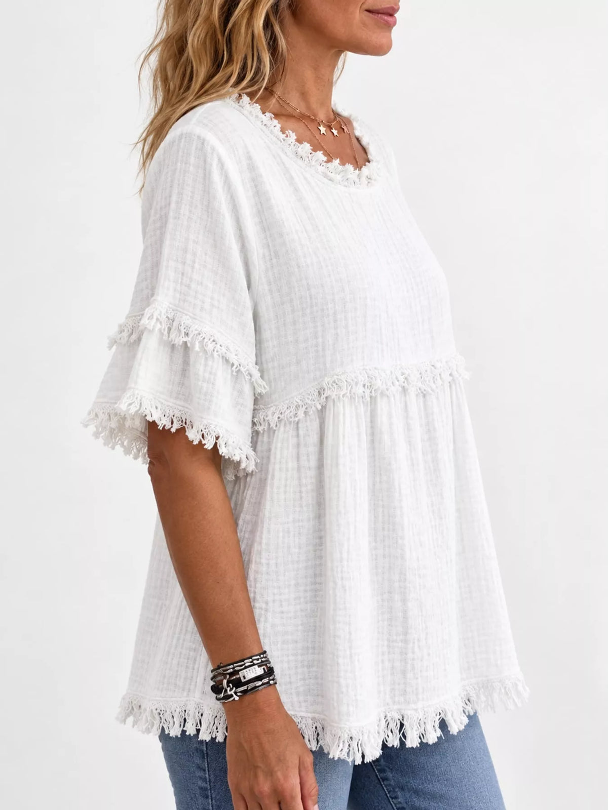 White frayed edge textured blouse, side view