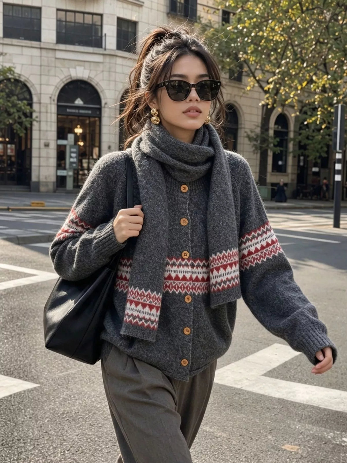 Charcoal geometric button-front knit cardigan, front view with arm extended.
