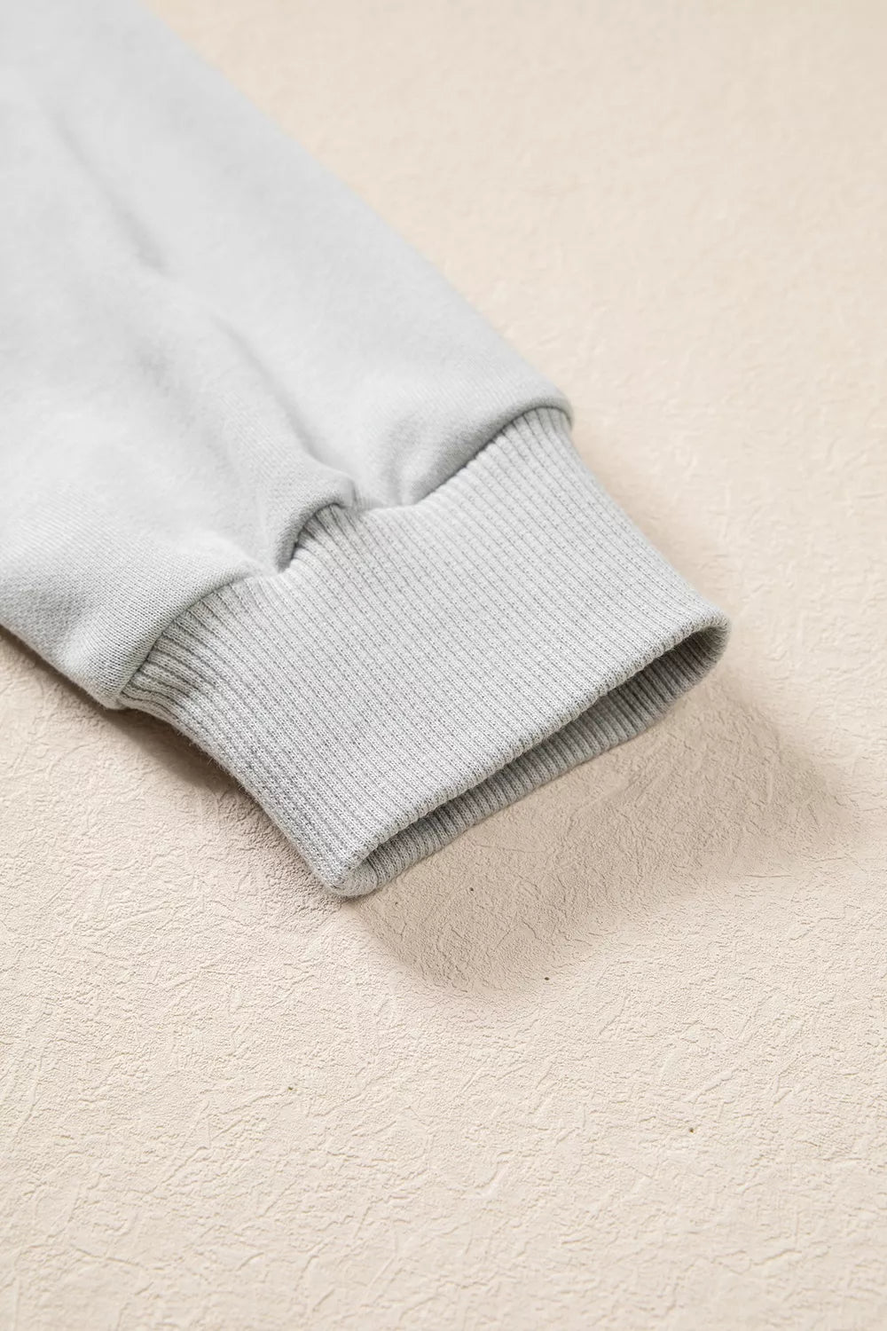 Gray floral and plaid PRAY patch sweatshirt, ribbed cuff