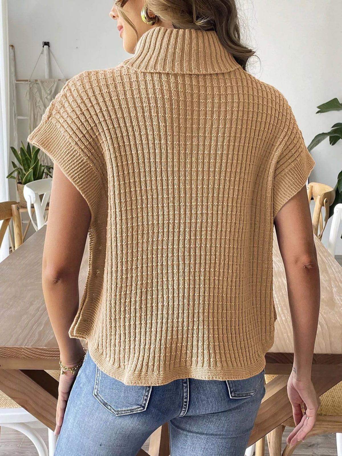 Camel ribbed turtleneck side-button sweater, back view.