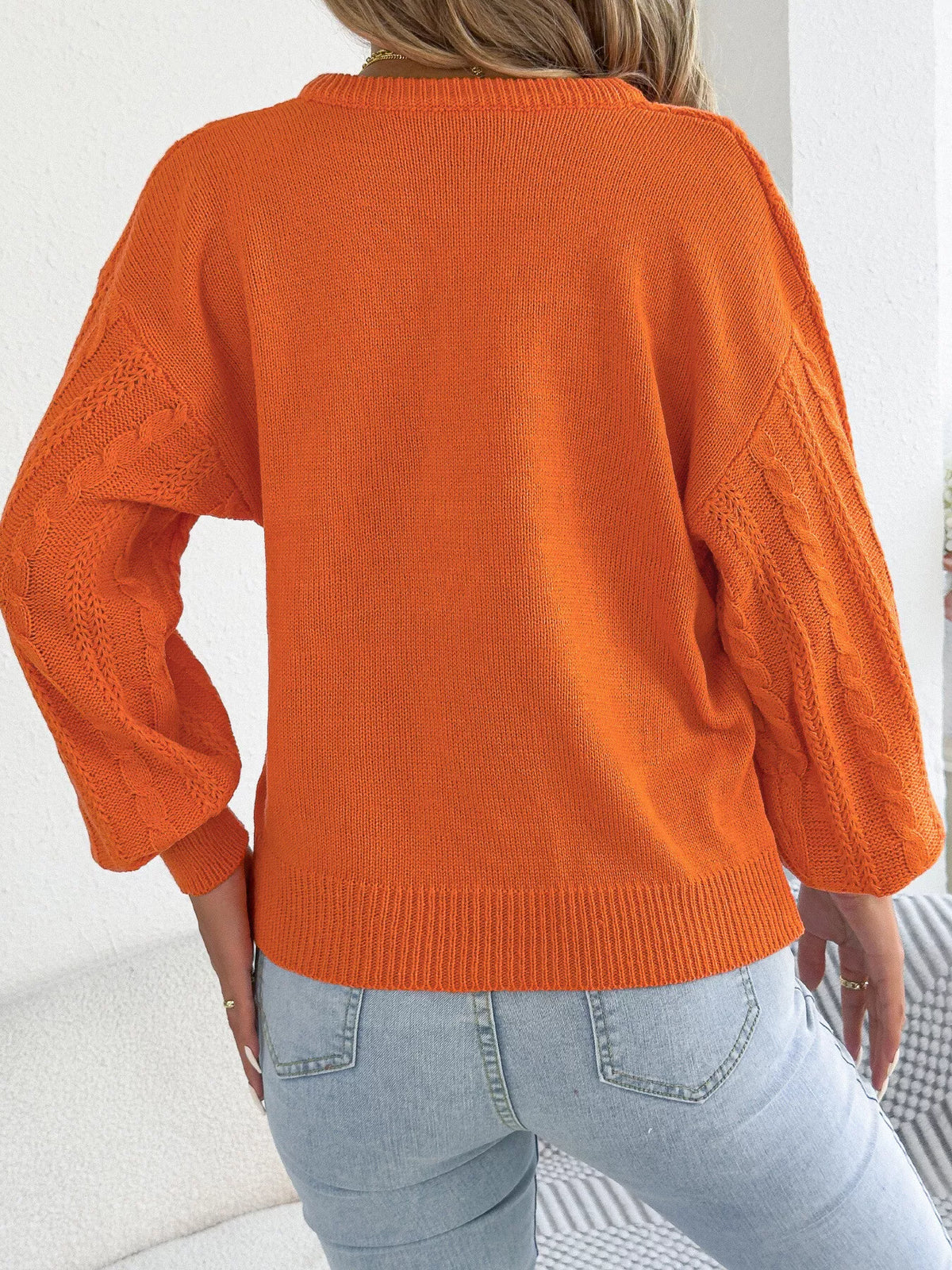 Cable knit notched sweater, back view