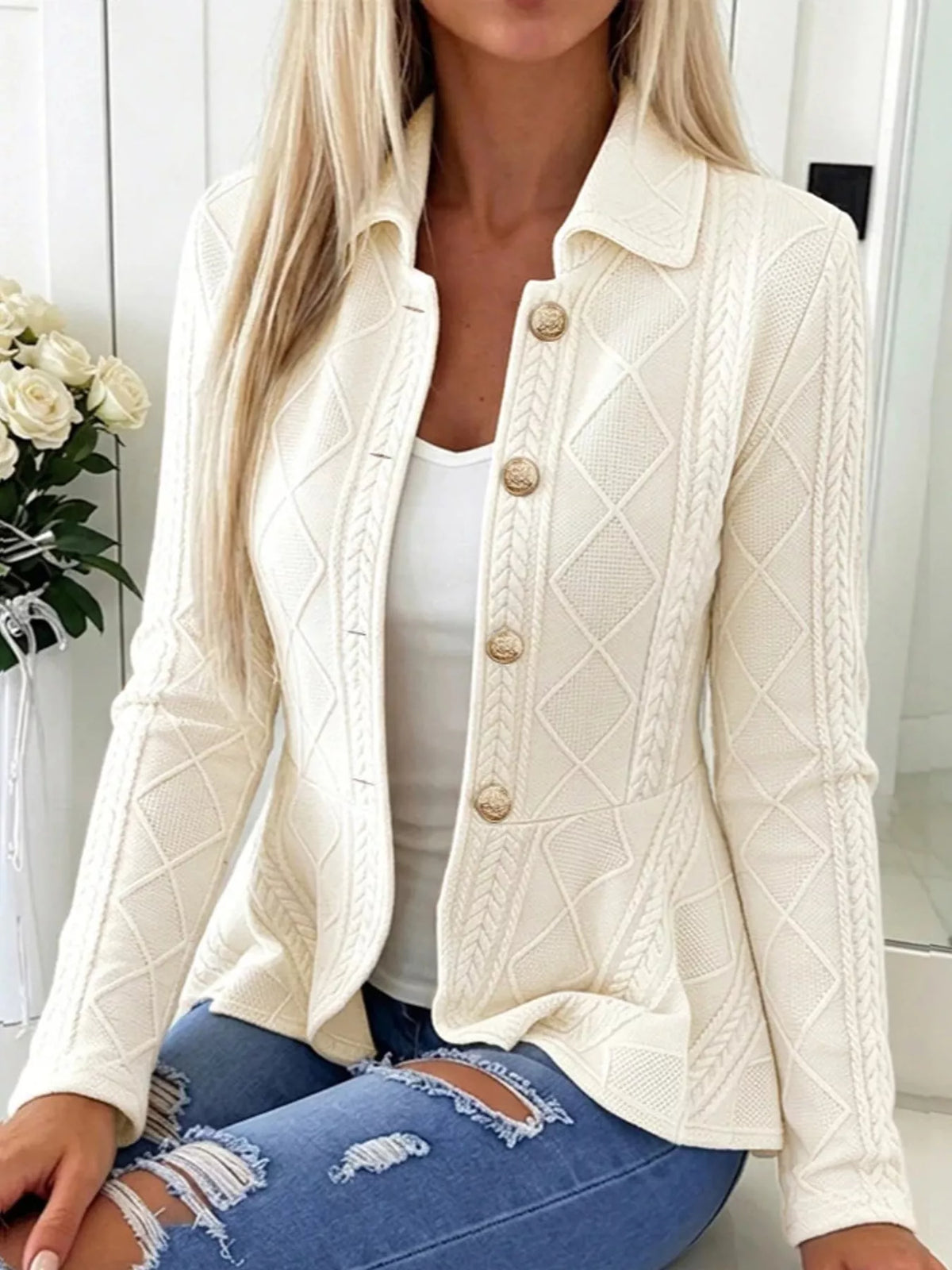 White cable-knit button-up cardigan — front view