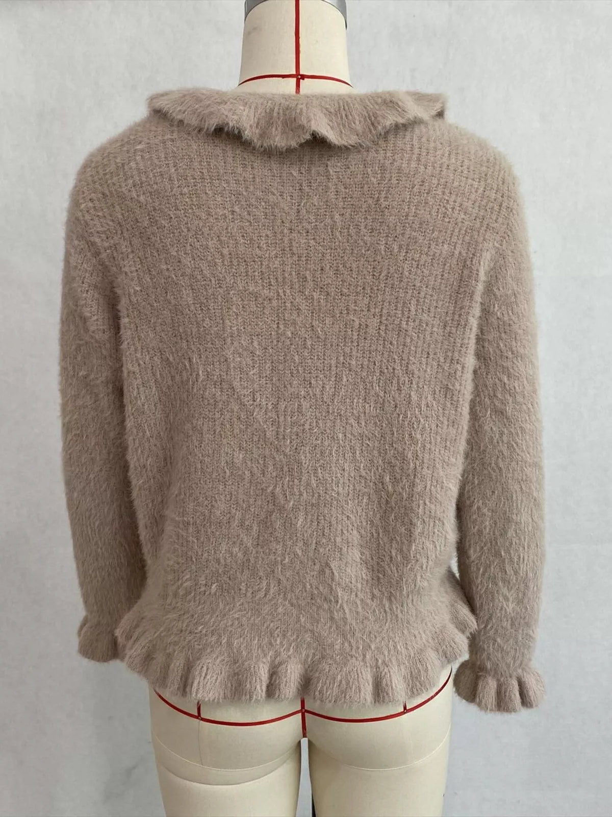 Taupe fuzzy ruffle-trim button-front cardigan, back on dress form.