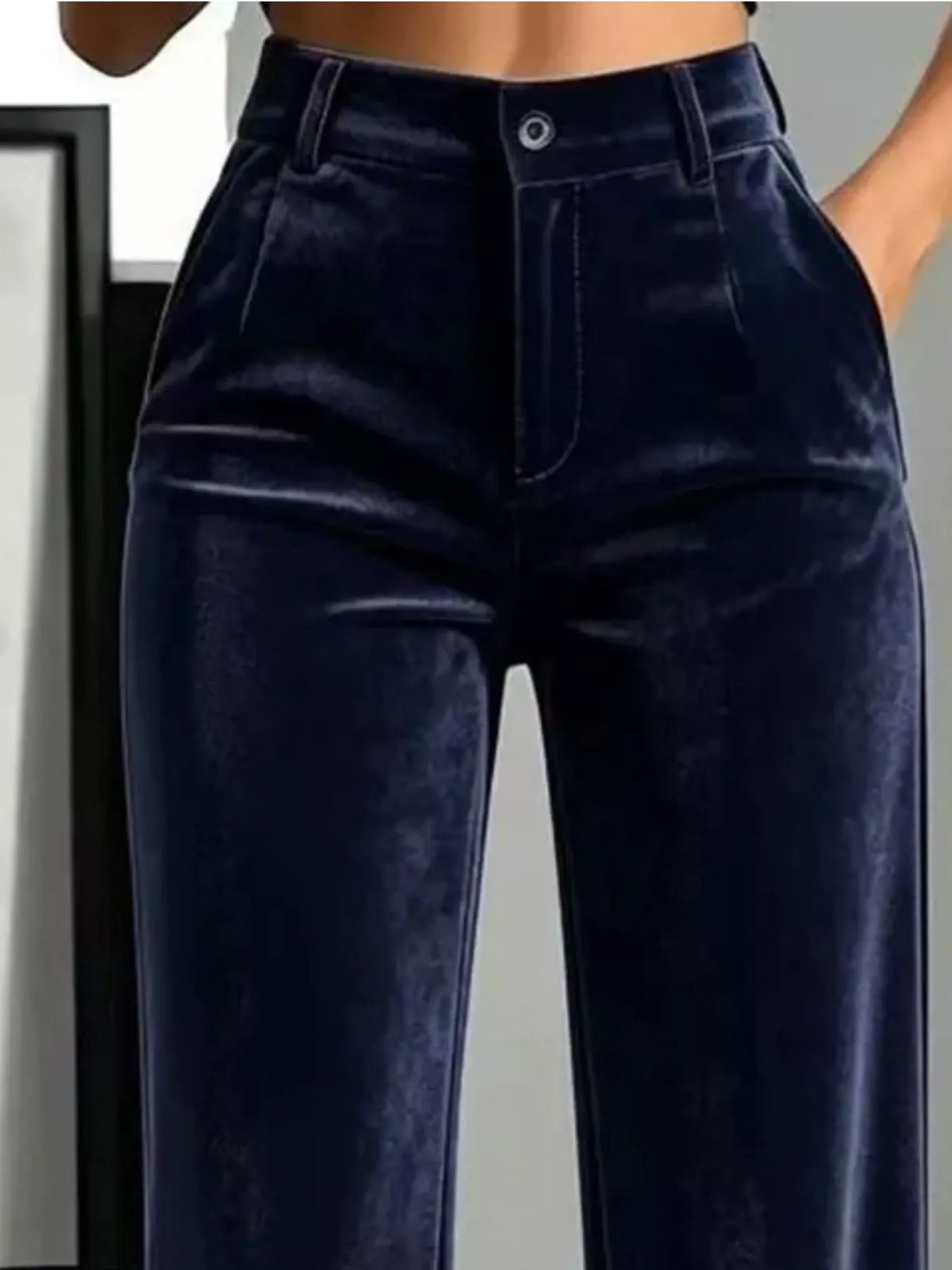 Navy velvet pants, buttoned waist, belt loops, and side pockets