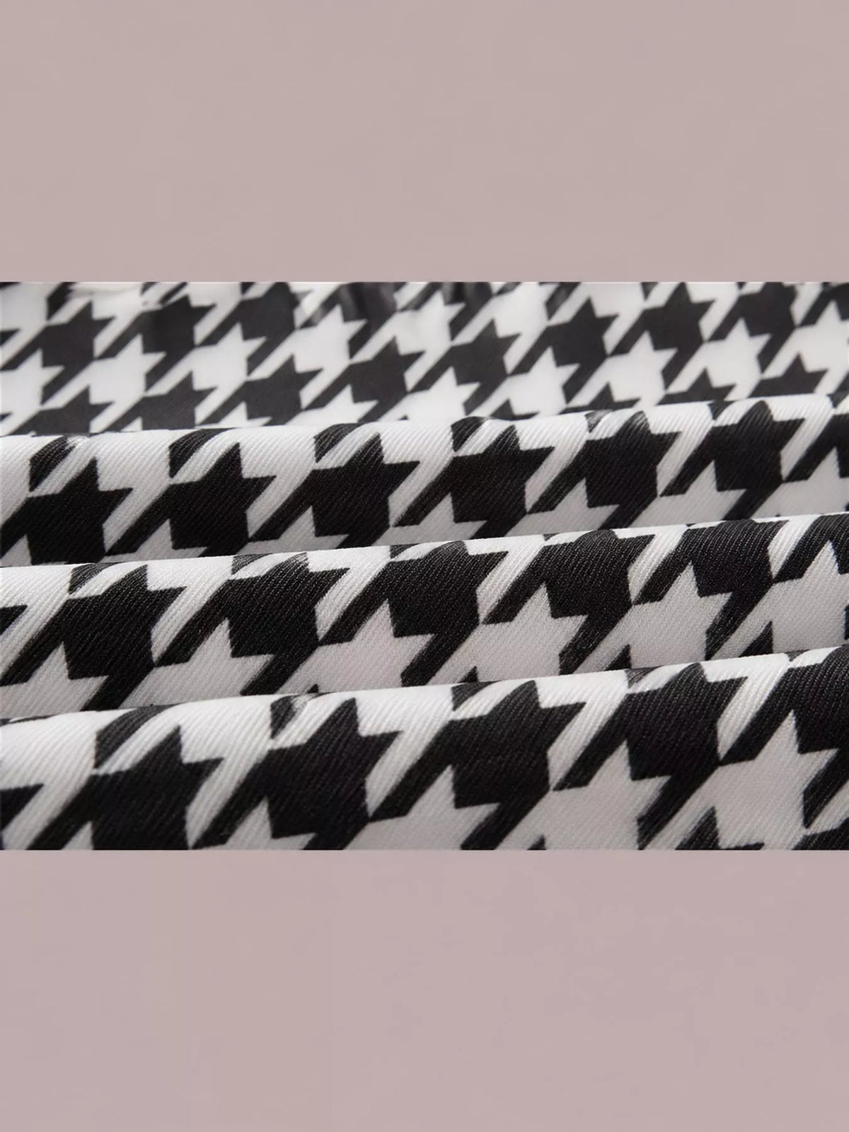 Black and white houndstooth printed zip-up bomber jacket — design and construction details