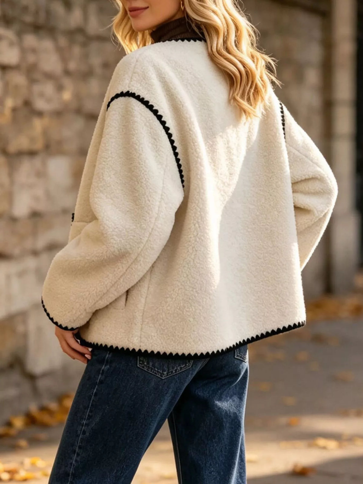 Cream with black trim faux shearling contrast trim button-down jacket, back view