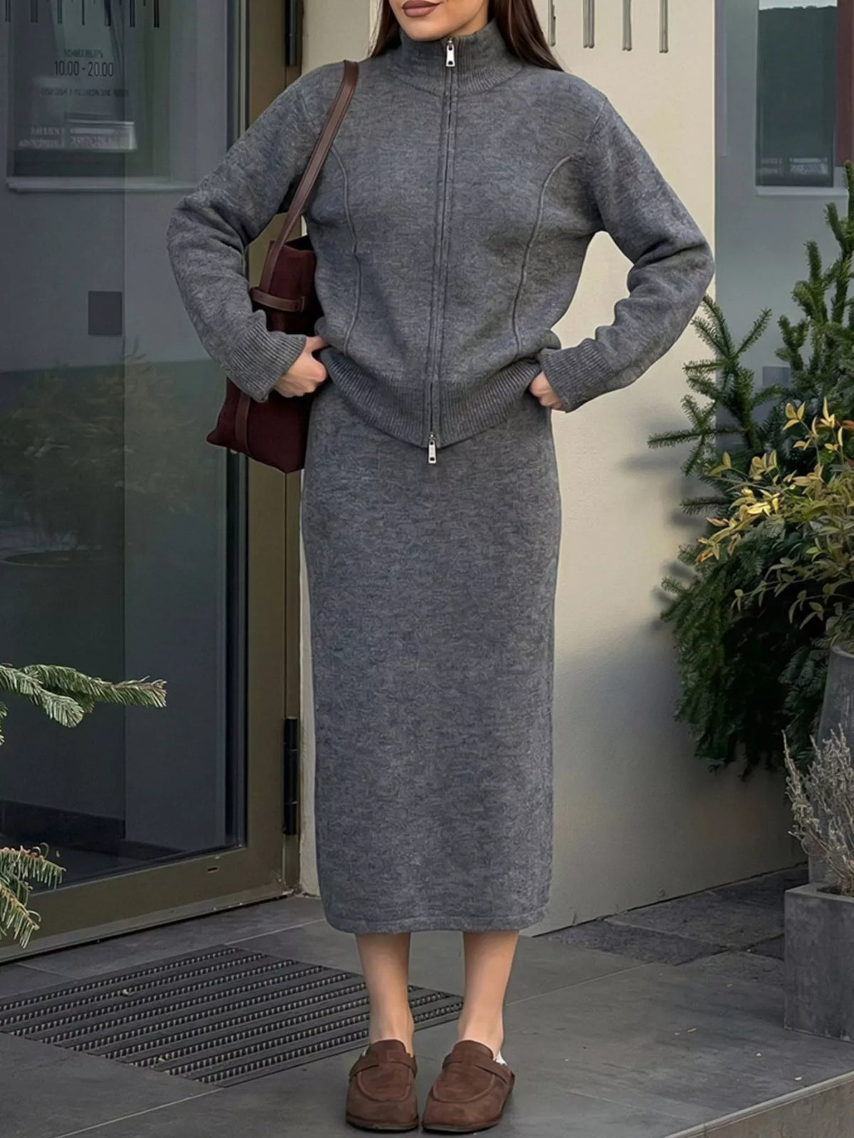 Zip-up cardigan and midi skirt knit set in dark gray, hands-on-hips view