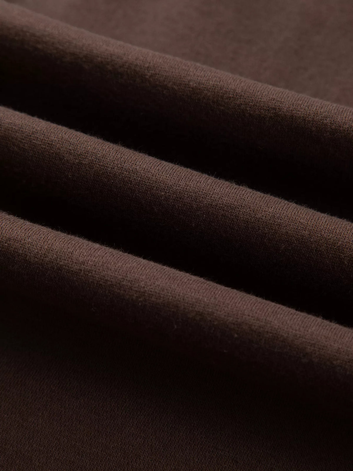 PRAY Polka Dot Embroidered Mock Neck Sweatshirt in dark brown, construction detail