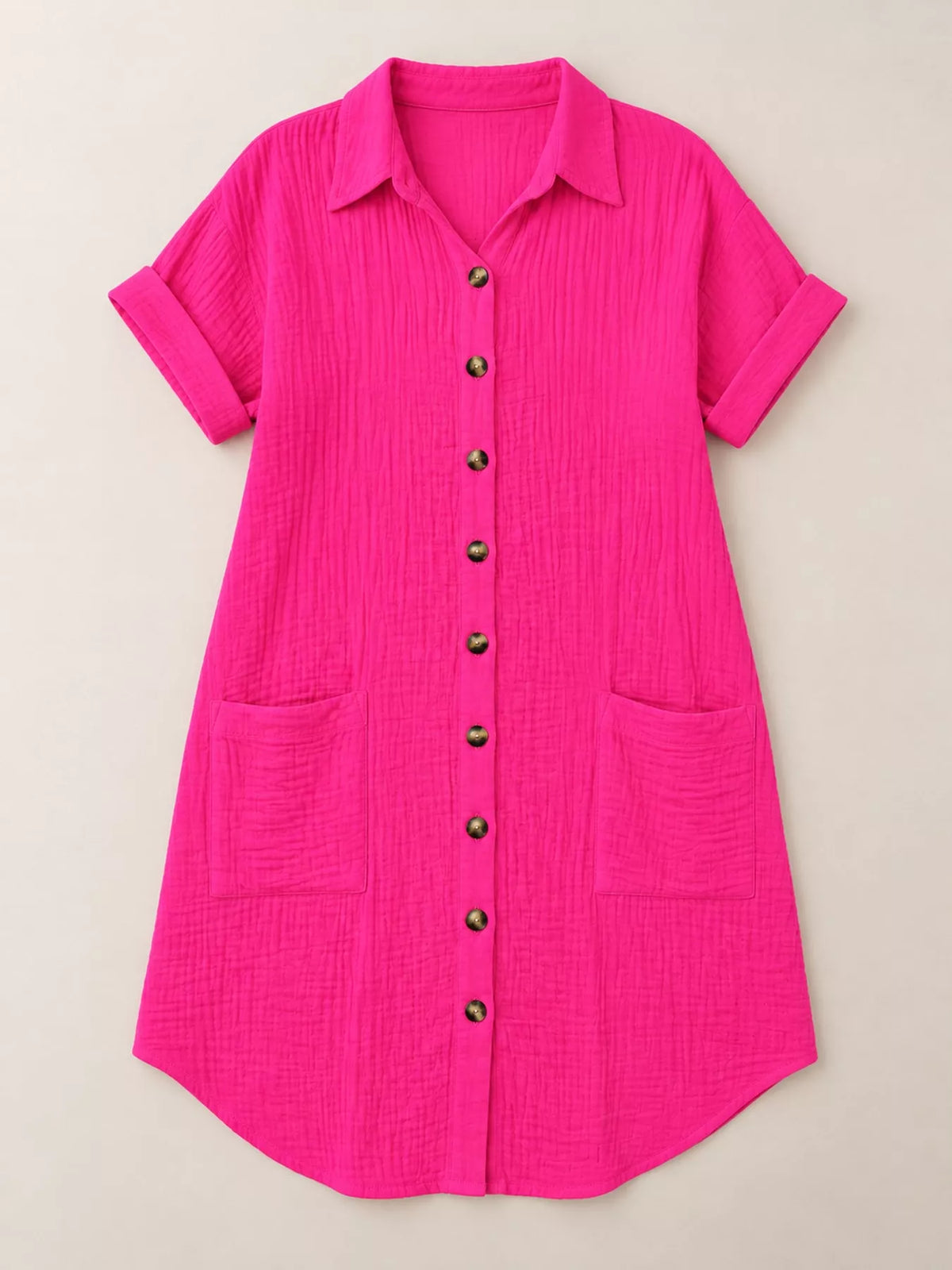 Hot pink textured button-front shirt dress with pockets, on hanger