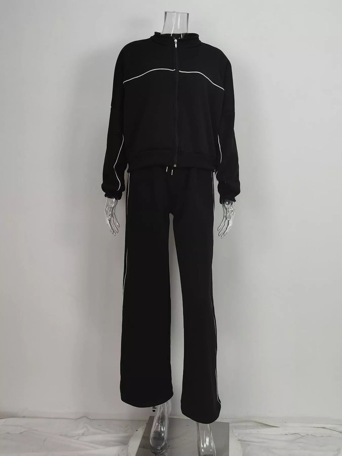 Black zip-up jacket and wide-leg pants set, back view