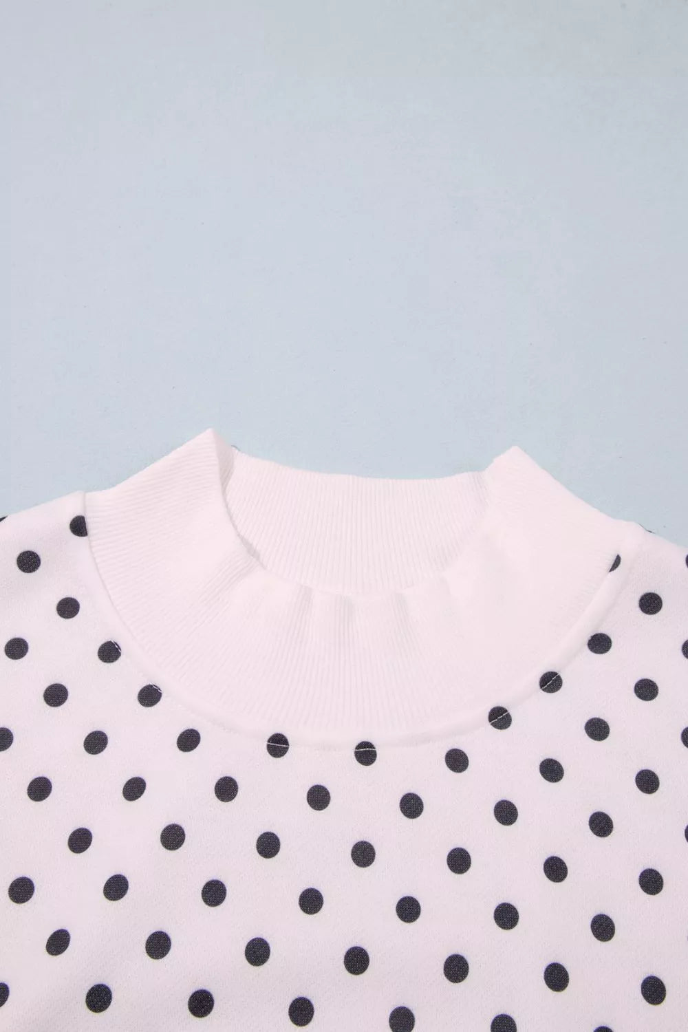 White polka dot mock neck sweatshirt