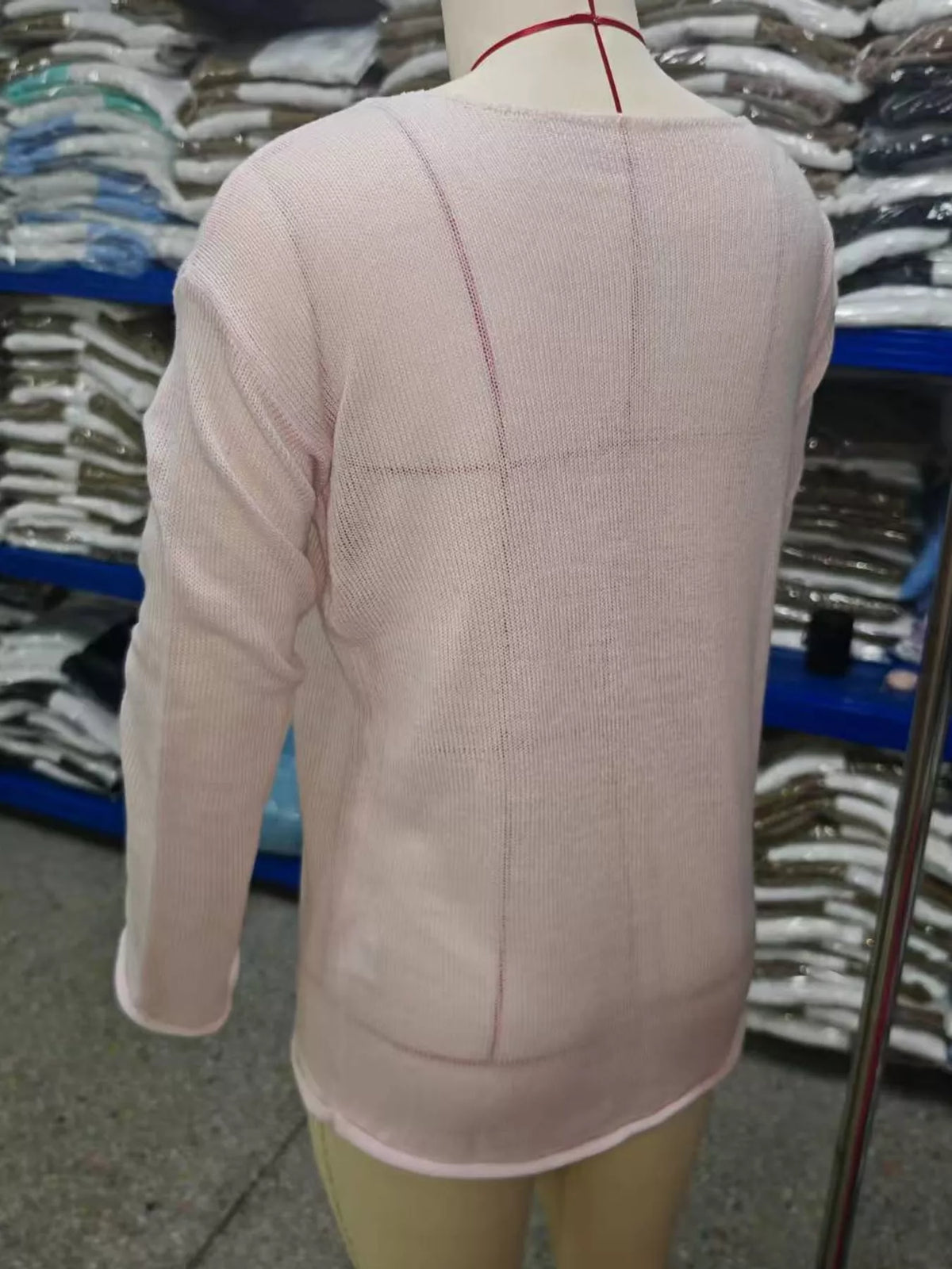 Pink sheer openwork knit long sleeve top, back view