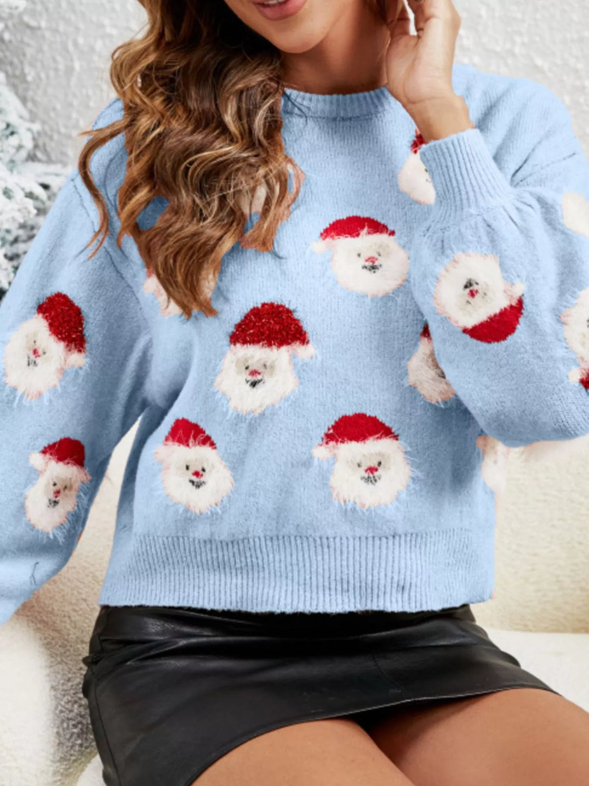 Light blue christmas santa pattern fuzzy sweater, seated front view with Santa faces.