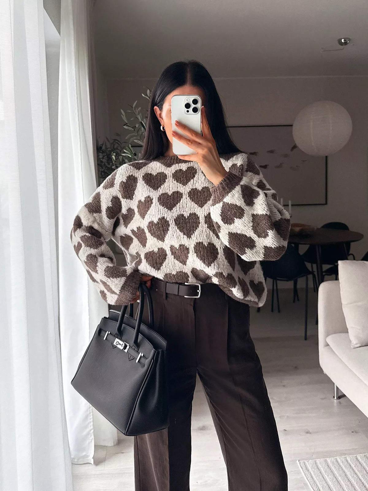 Cream and brown allover heart dropped-shoulder sweater, front view.