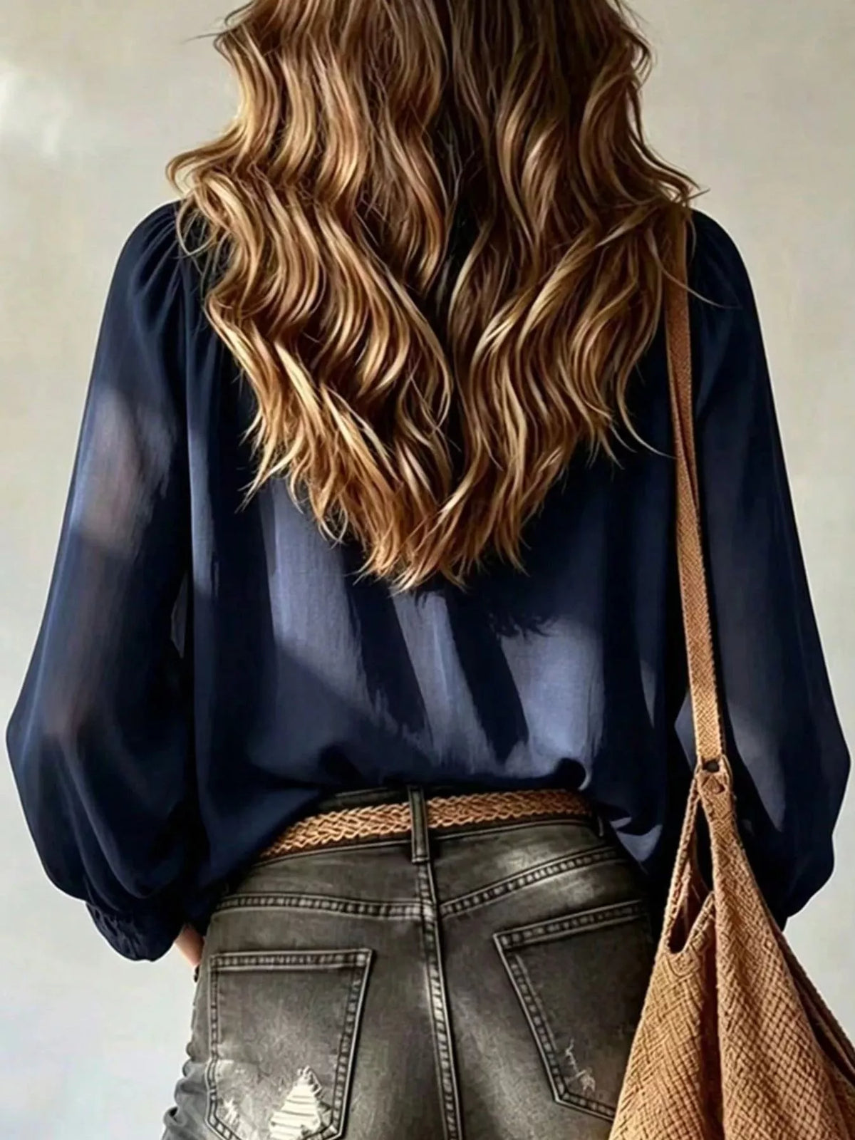 Dark Blue ruffled v-neck blouse with tie-front detail, back view