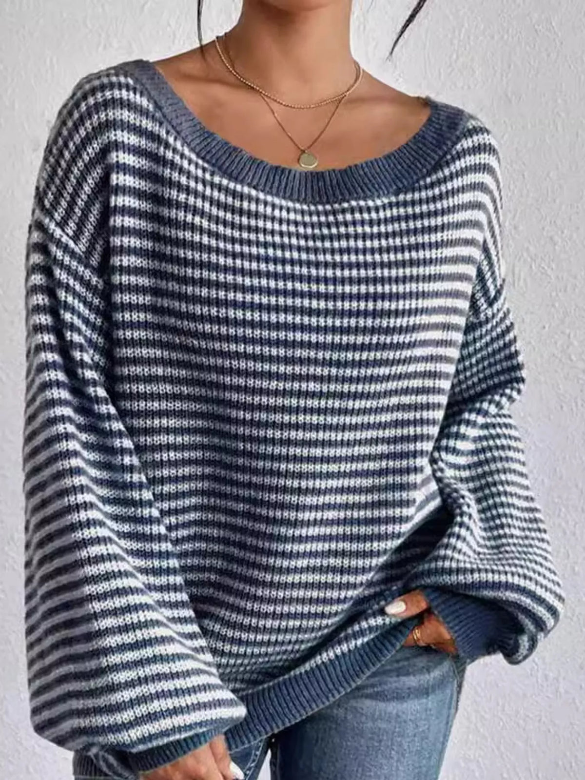 Blue and white striped knit boat neck sweater