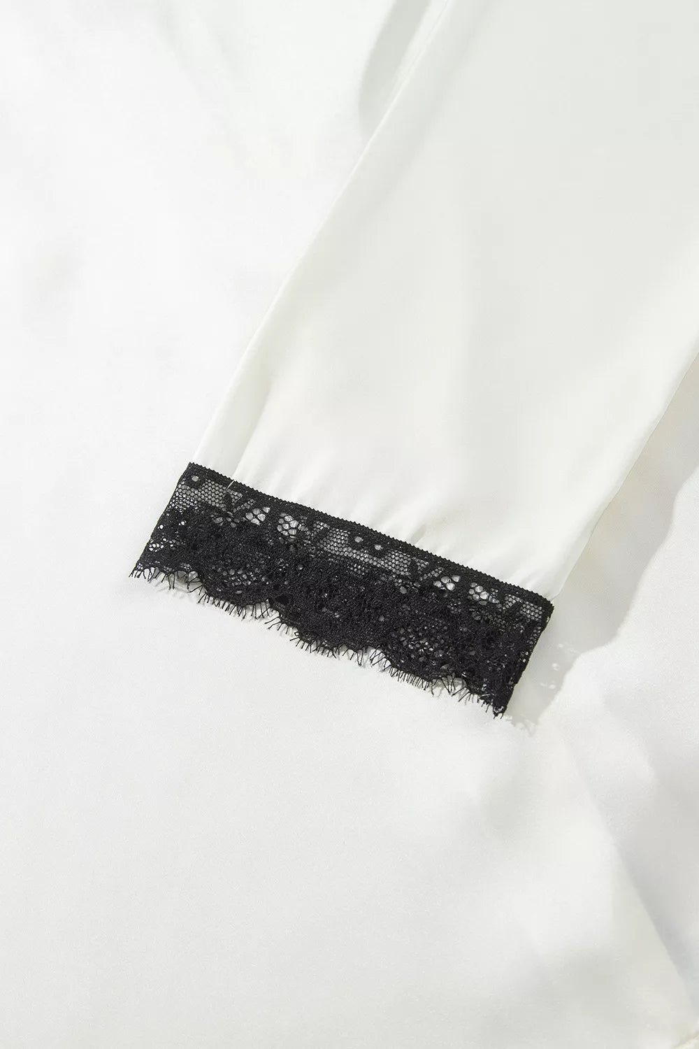 Ivory lace-trim button-front pajama set, lace-trim cuff detail.