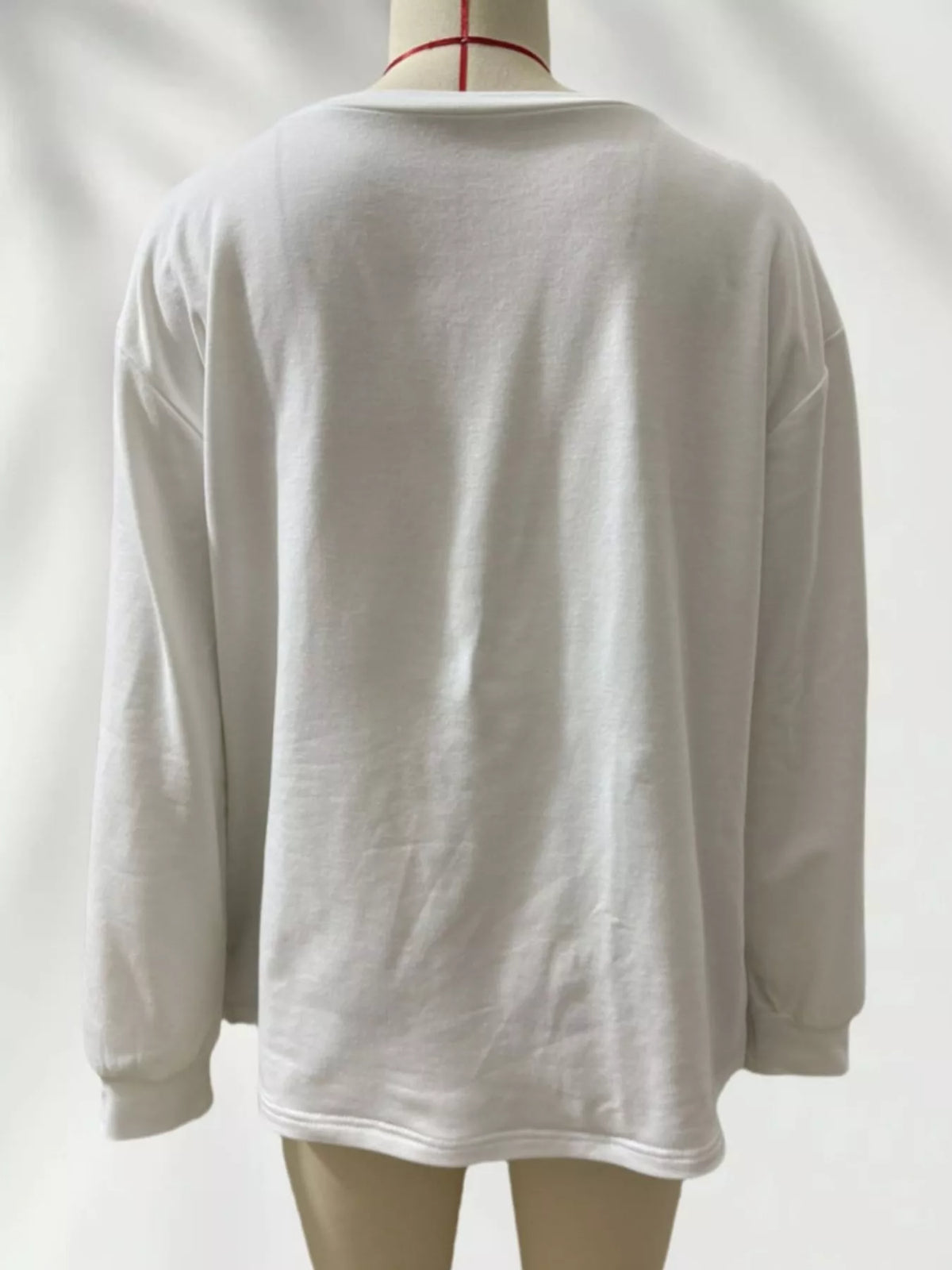 White color-block ruffled hem top, back view