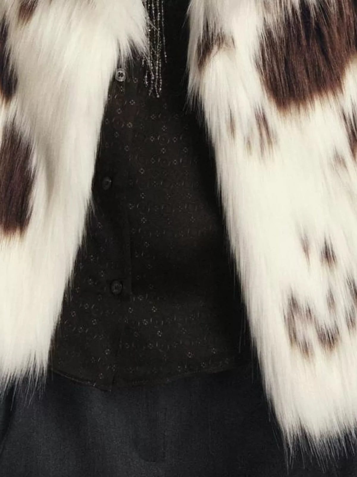 White cow-print faux fur coat, detail view