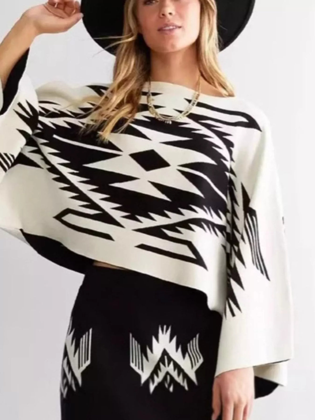 Geometric knit sweater, black and white front