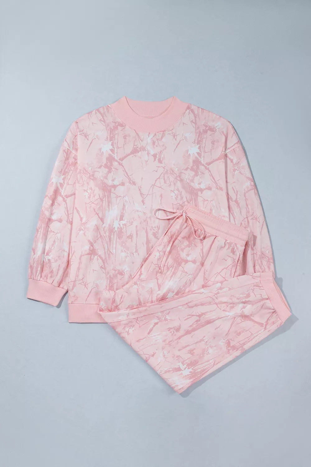 Pink camouflage top and pants set, top and pants laid flat