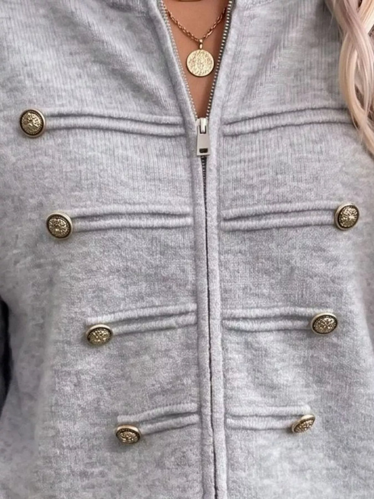 Gray zip-up long sleeve cardigan with decorative buttons, zipper and decorative button detail