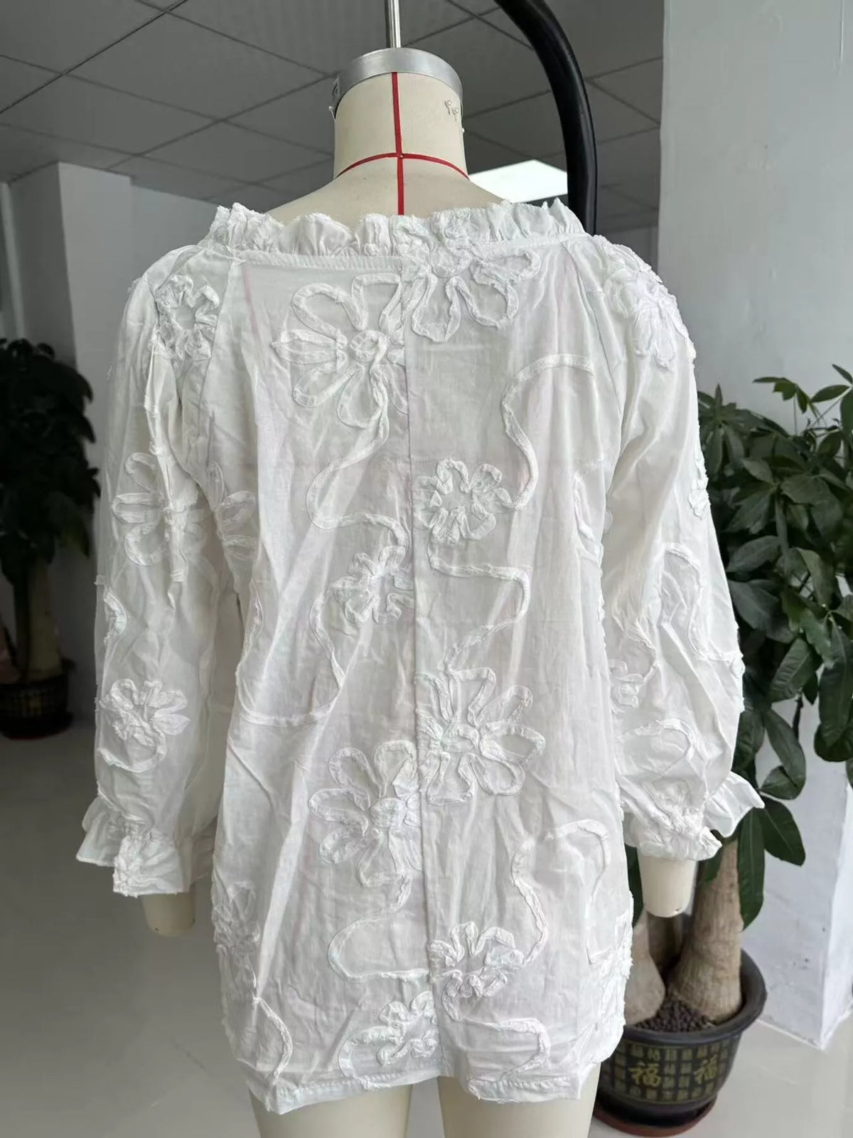 Floral Tie Neck 3/4 Sleeve Blouse in white, back on dress form view