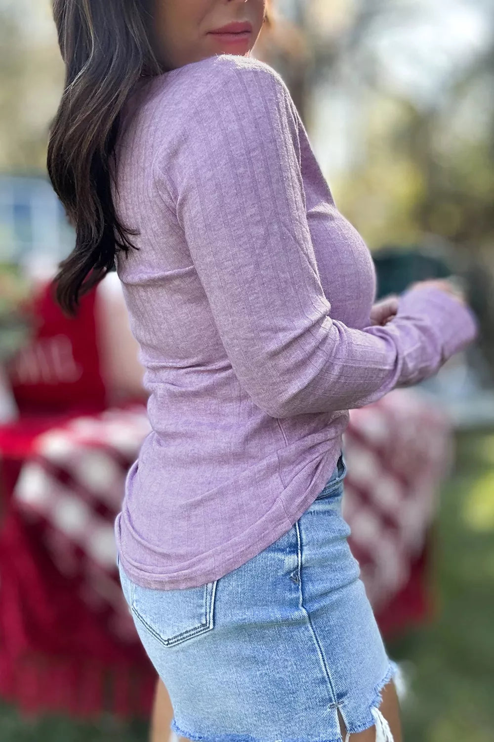 Purple ribbed long sleeve top, side view