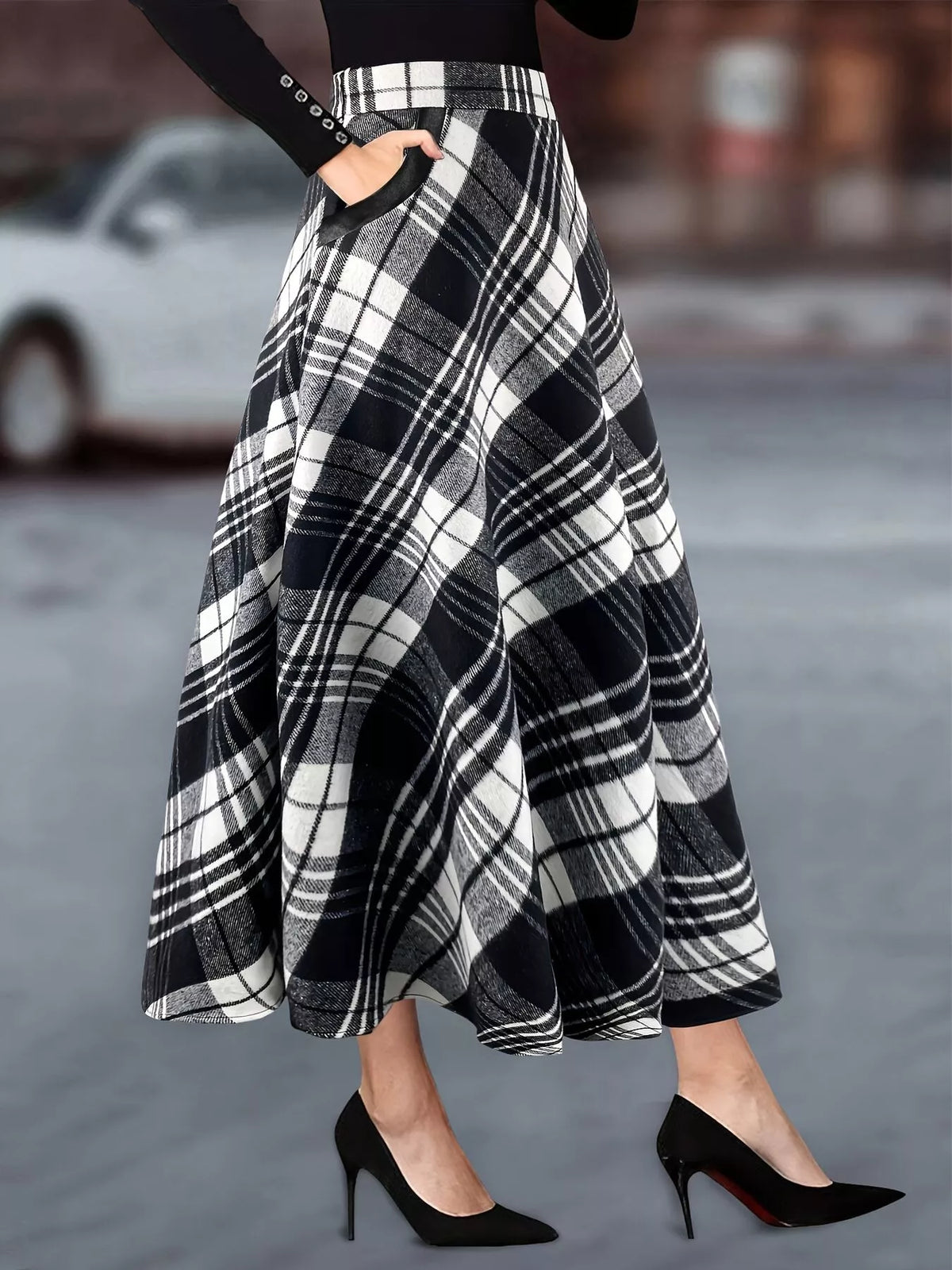 Black and white plaid A-line midi skirt, worn front view