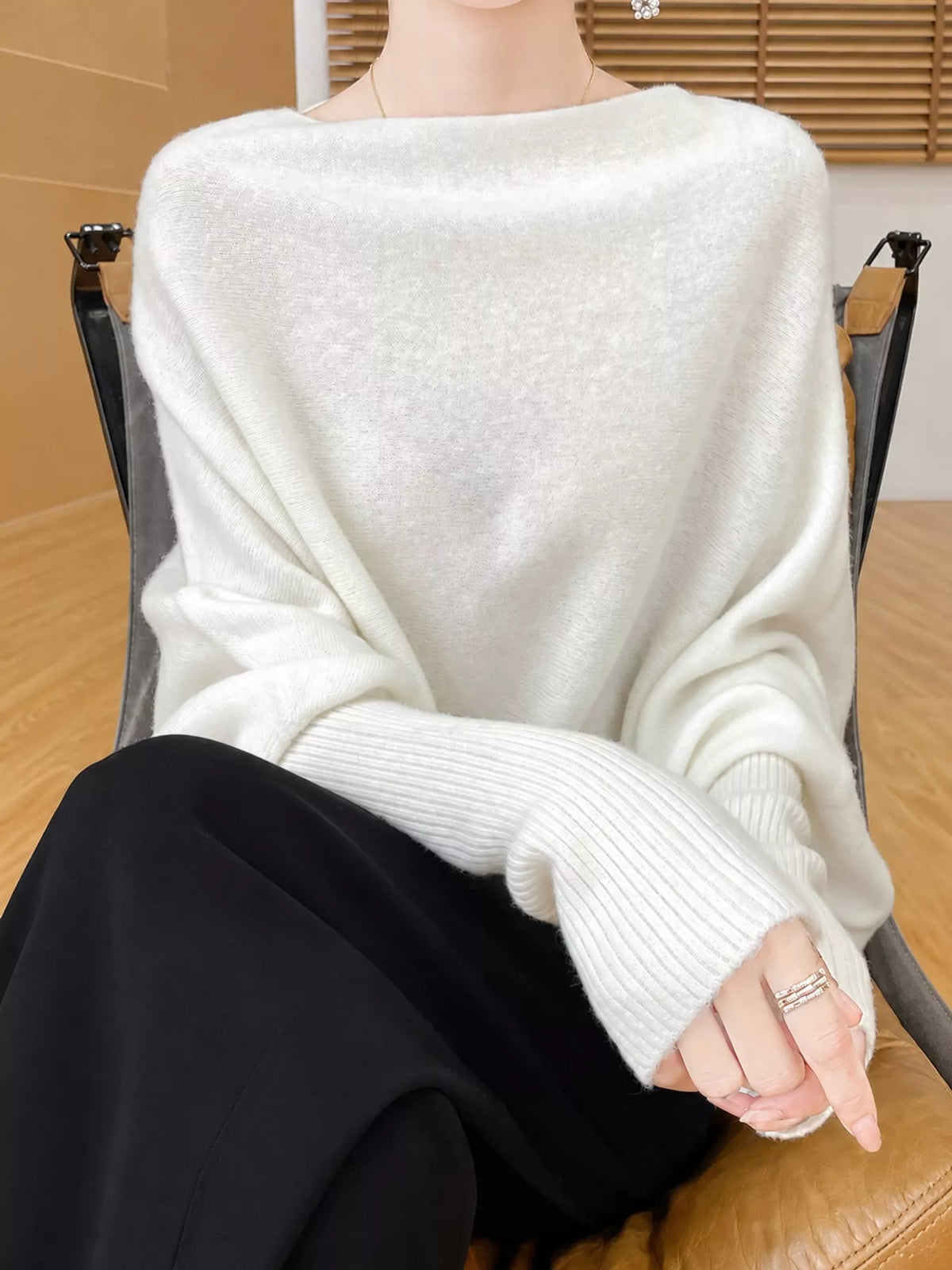 White asymmetrical lantern sleeve sweater — front view