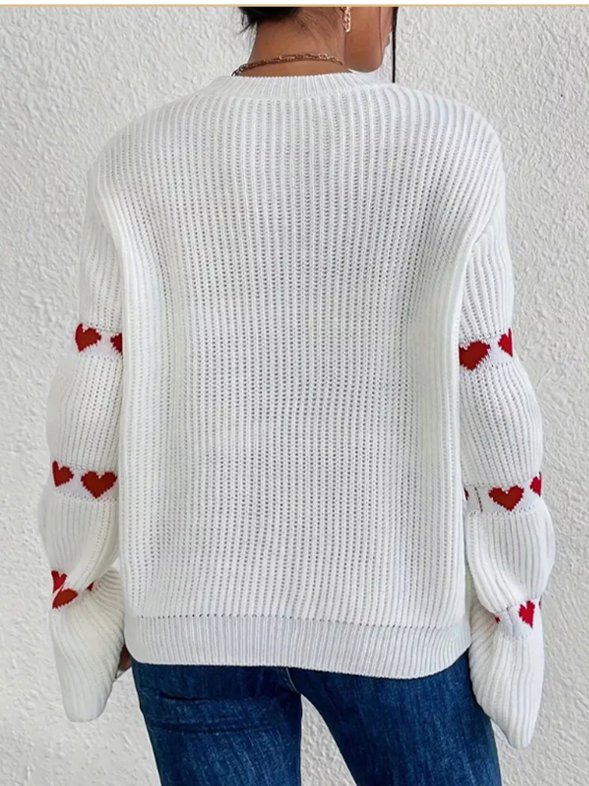 White and red heart-sleeve dropped-shoulder sweater, back view.