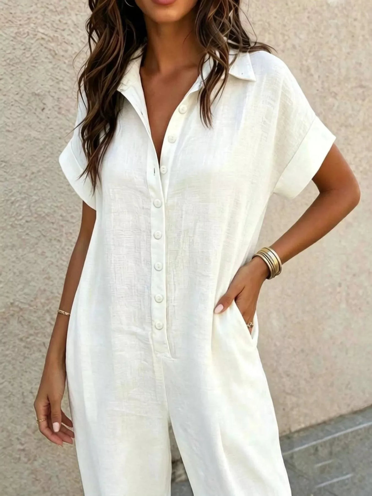 White button-front jumpsuit, collar and button detail