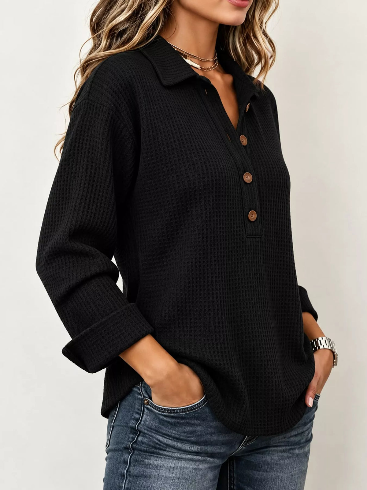 Black waffle knit long sleeve polo top, side view