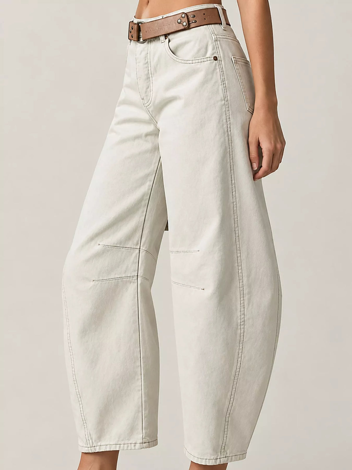 Cream barrel-leg jeans, side view