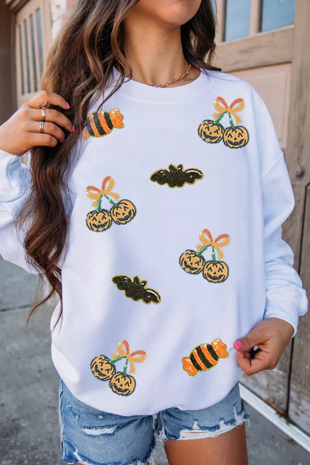 Sequin Halloween Pattern Pullover Sweatshirt in white, front view