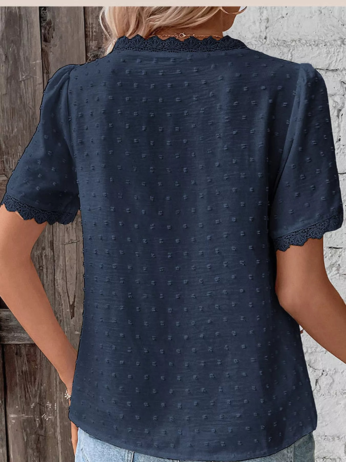Navy swiss dot v-neck blouse with lace trim, back view