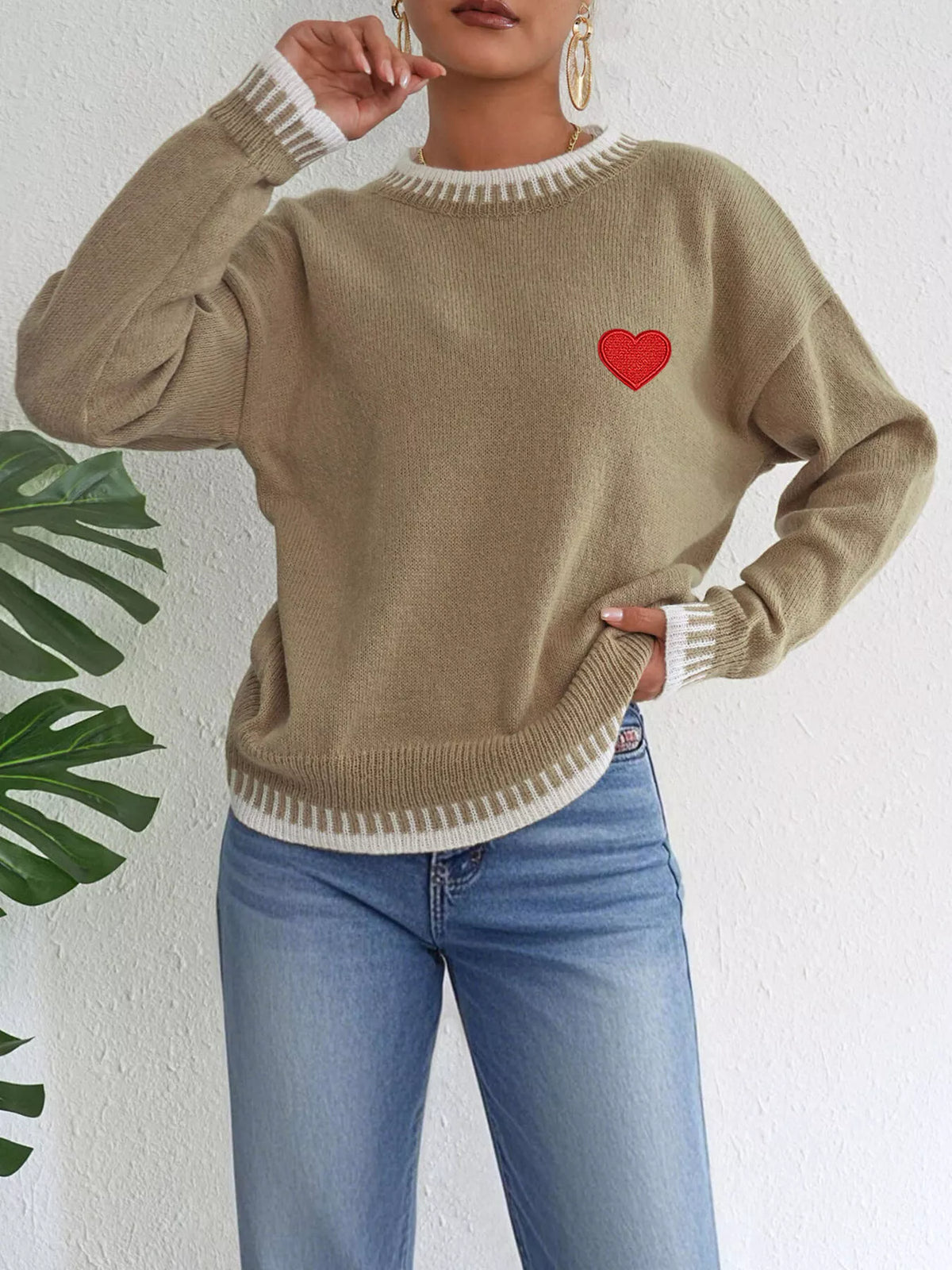 Heart-embroidered contrast-trim sweater in camel, raised-arm view