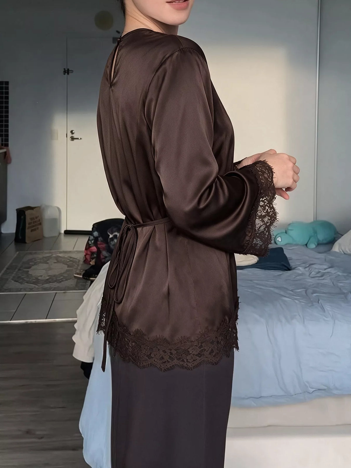 Coffee satin lace-trim blouse with flounce sleeves, side view