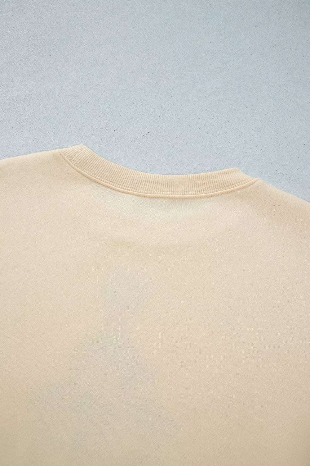 Back neckline on cream christmas tree merry christmas and happy new year sweatshirt