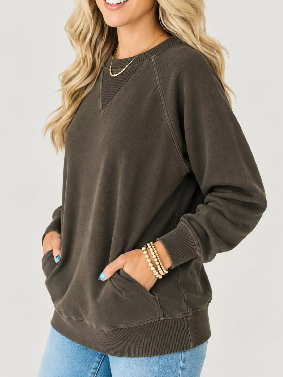 Brown crew neck raglan sleeve sweatshirt, side view
