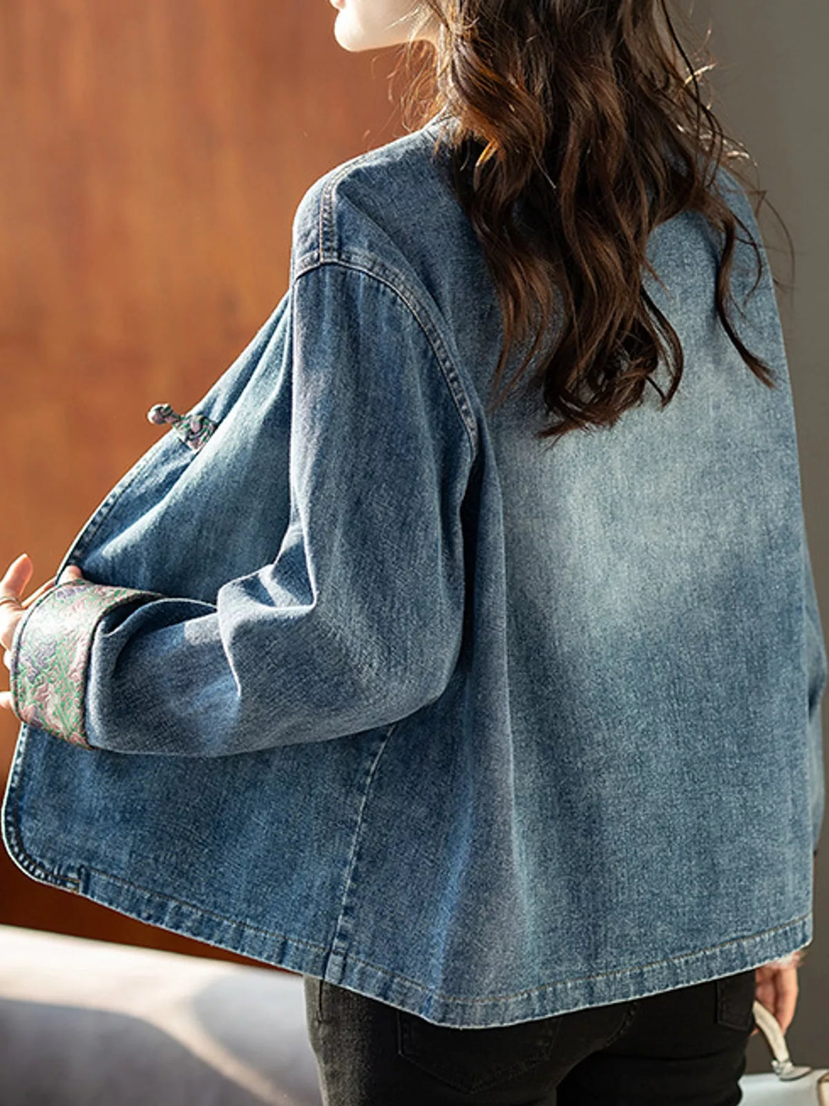 Blue knot button floral cuff denim jacket, back view