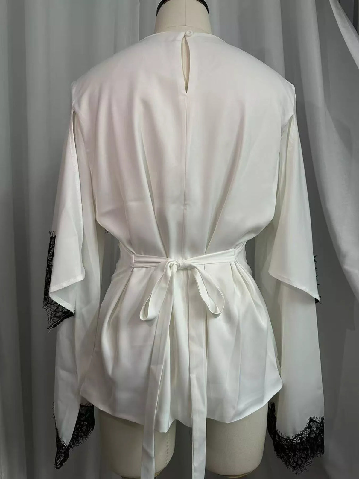 Round neck long sleeve blouse, back view