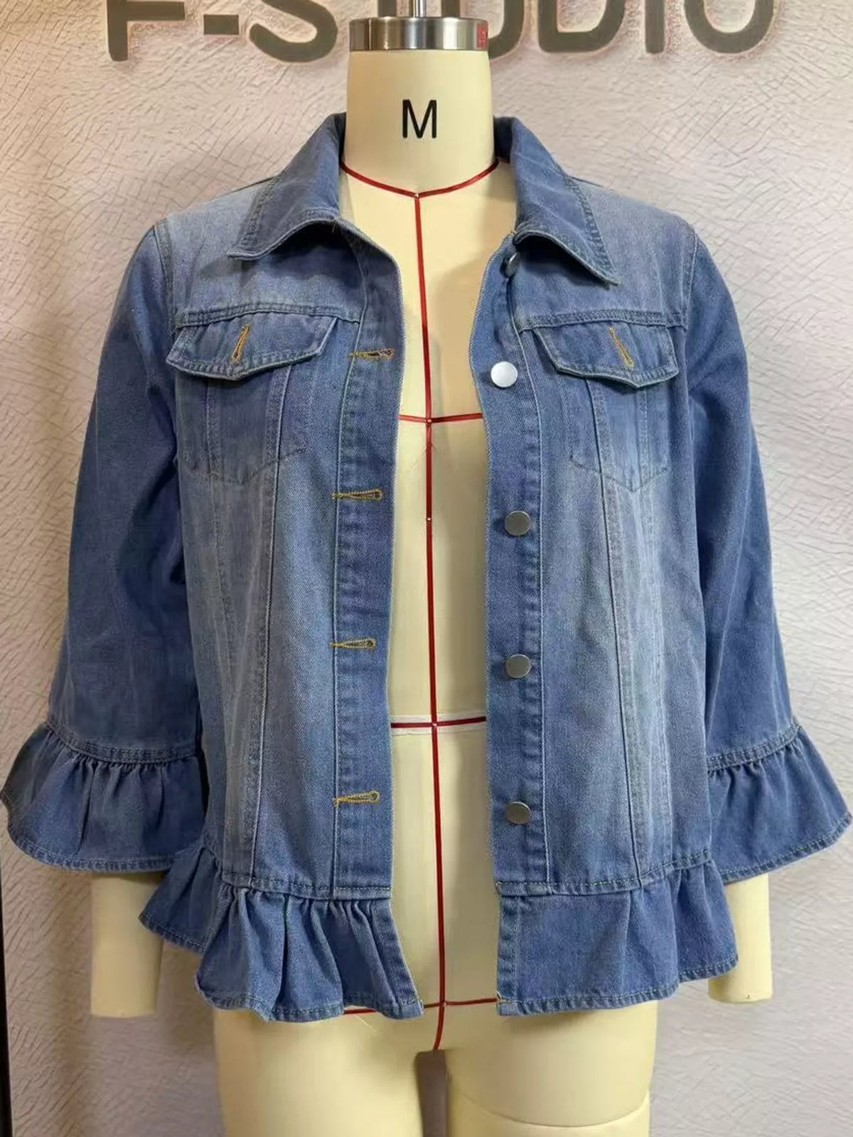 Blue ruffle hem denim jacket, front view